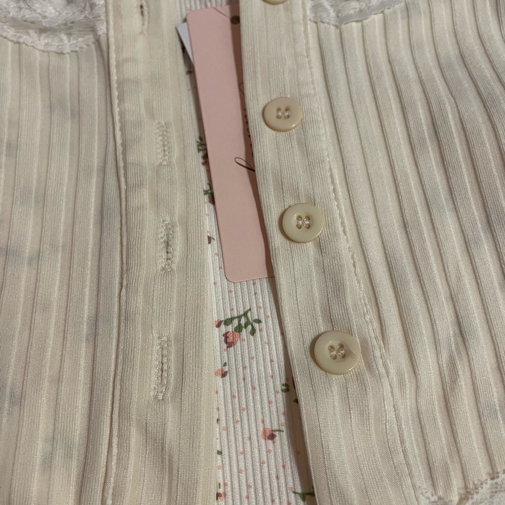 Crème coloured blouse with pink floral spaghetti strap crop top